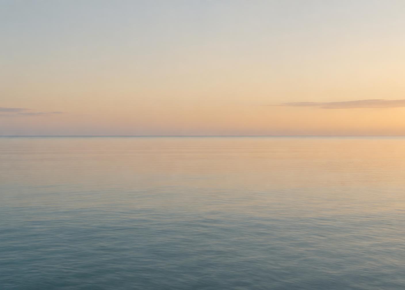 A calm sea at dawn